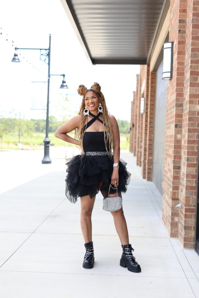 what to wear to a summer concert black shorts with tutu black bodysuit black boots with chain